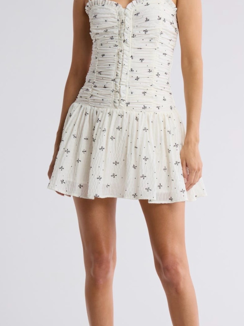 Lush Cream Mini Skirt with Black Floral Motif